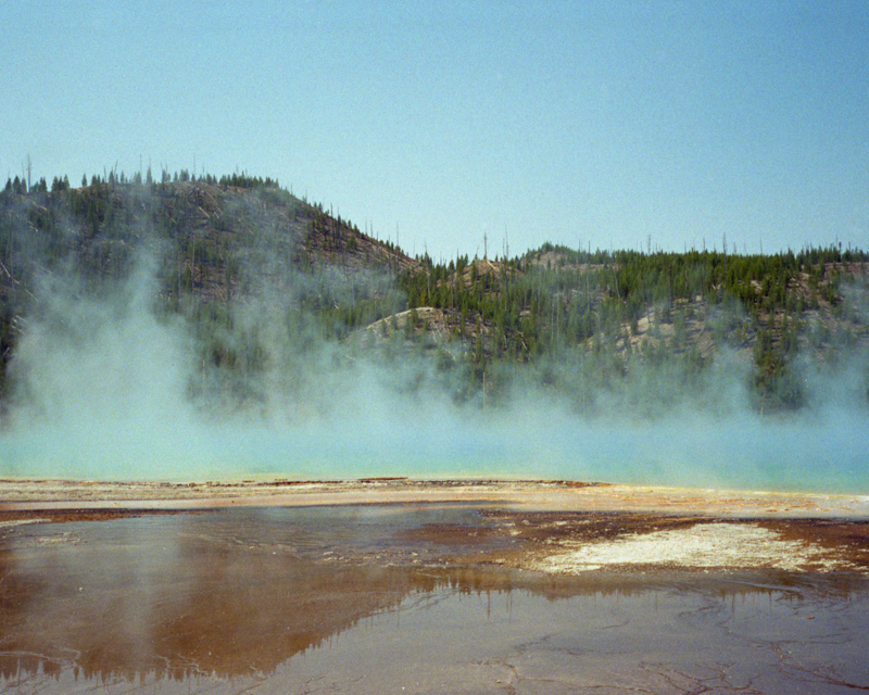 Fog rises from prismatic lake